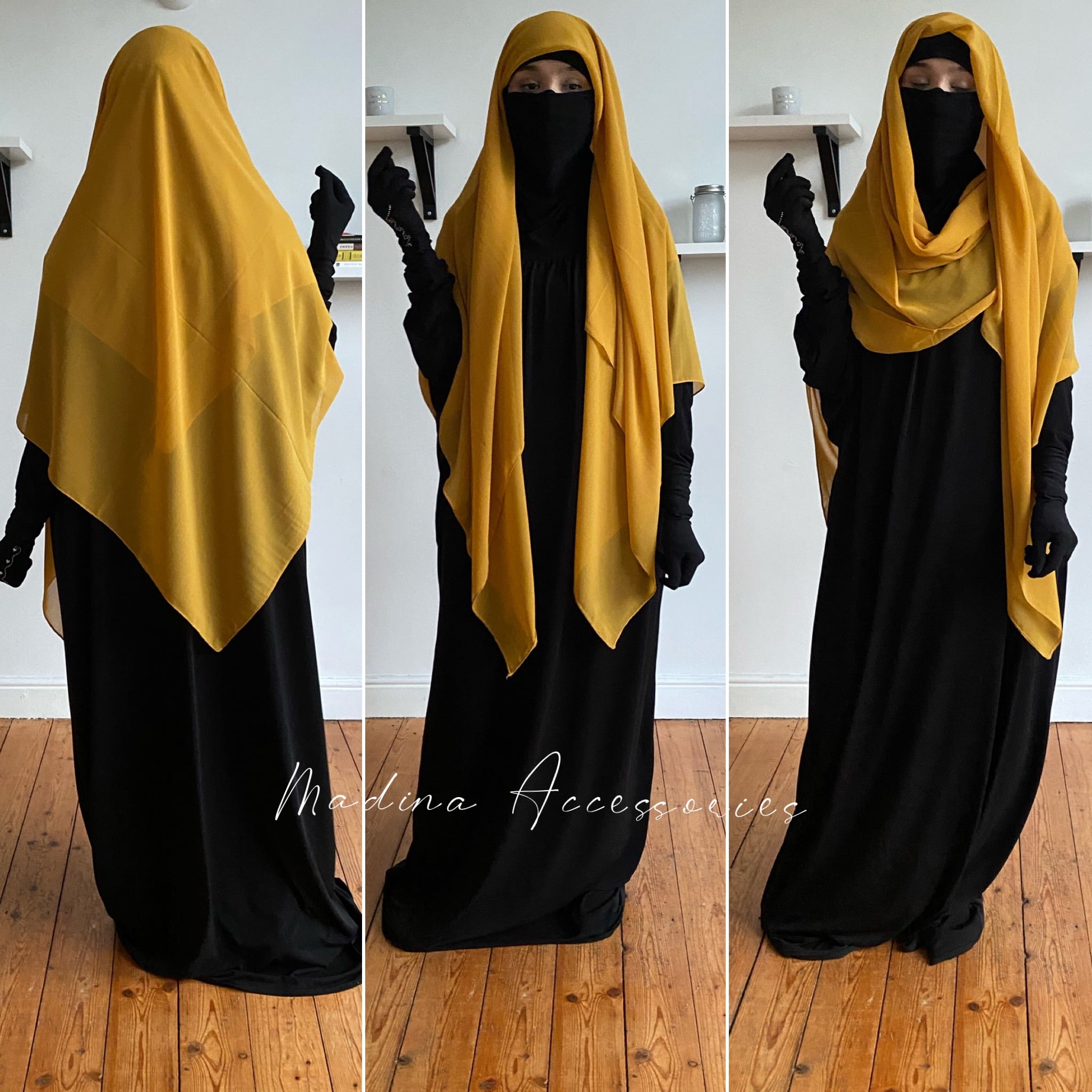 Woman in a vibrant yellow square hijab over a black gown, posing in a room with minimalist decor.